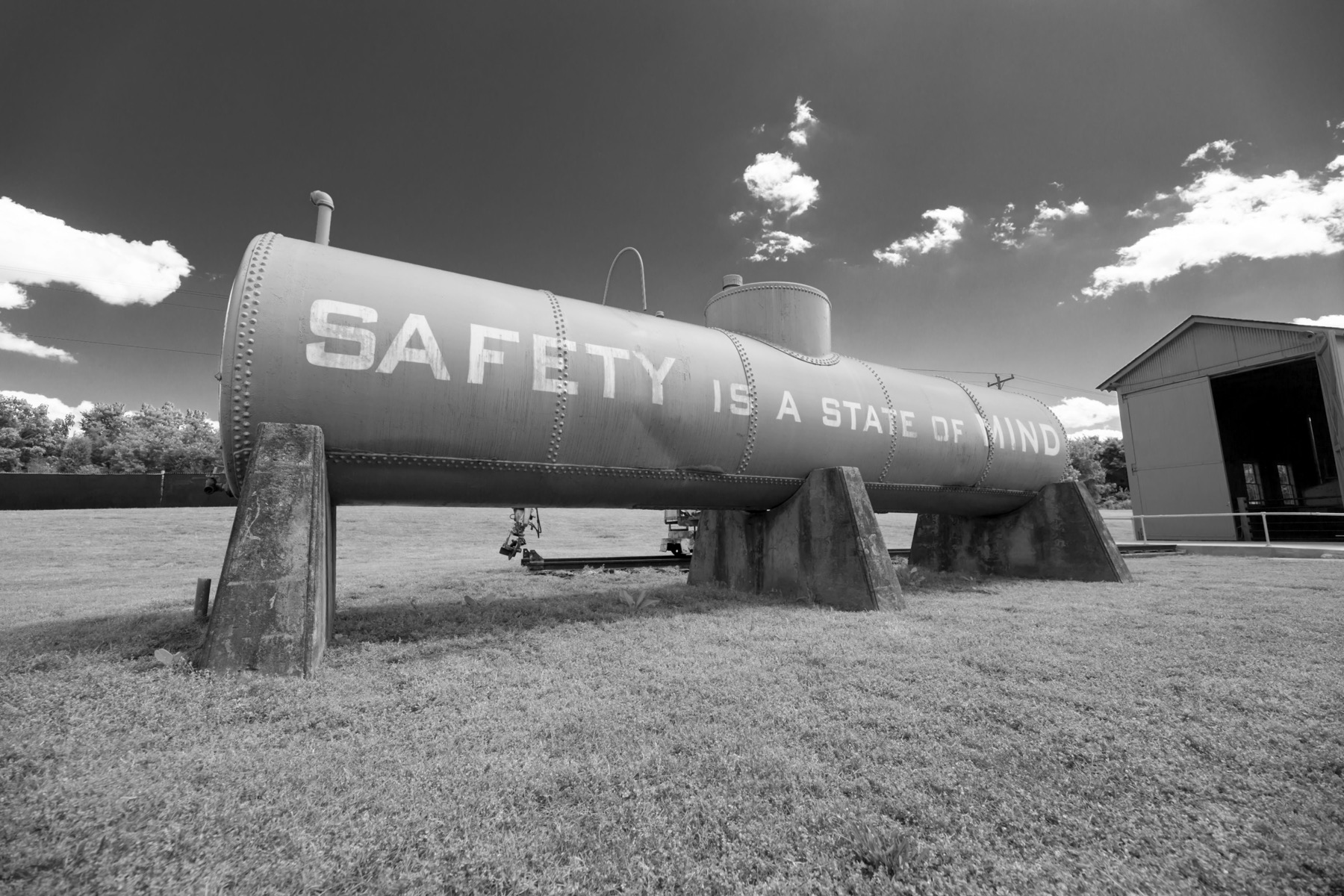 Industrial tank with safety message painted on the side